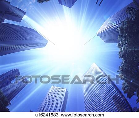 Sun shining over skyscrapers View Large Photo Image Stock Image - Sun shining over skyscrapers. Fotosearch