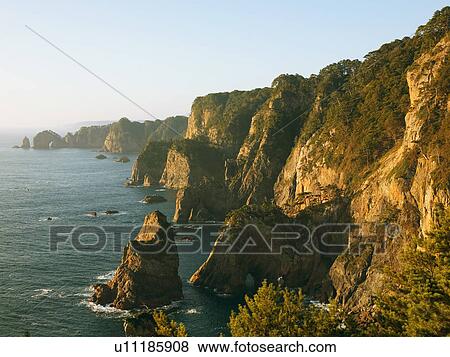 Sunlight on cliffs above sea, Yamasaki, Tanohata-son, Iwate Prefecture, Japan View Large Photo Image Stock Photo - Sunlight on cliffs above sea, Yamasaki, Tanohata-son, Iwate Prefecture, Japan. Fotosearch