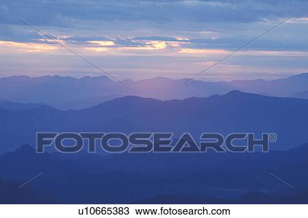 Stock Image - Sunrise over mountain range, Odaiba, Akita Prefecture, Japan. Fotosearch