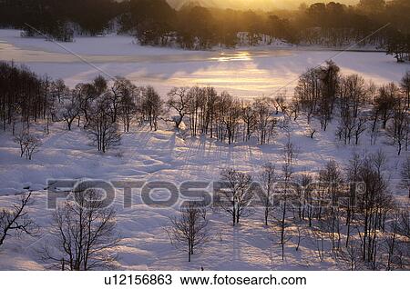 Stock Image - Sunrise over snowy landscape, Kitashiobara-son, Fukushima Prefecture, Japan. Fotosearch