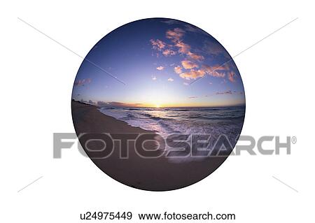 Stock Photo - Sunrise over the ocean. Fotosearch