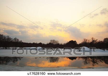 Sunset over pond, Kitashiobara-son, Fukushima Prefecture, Japan View Large Photo Image Stock Image - Sunset over pond, Kitashiobara-son, Fukushima Prefecture, Japan. Fotosearch