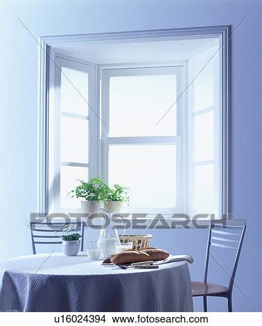 Picture - Table set with basket of bread. Fotosearch