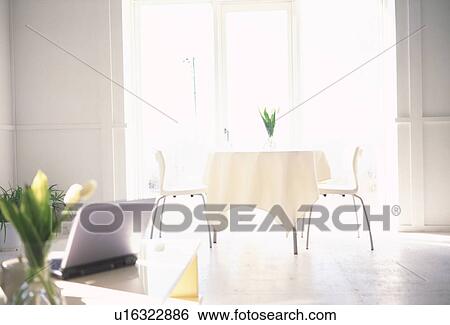 Table with vase and laptop View Large Photo Image Stock Photograph - Table with vase and laptop. Fotosearch