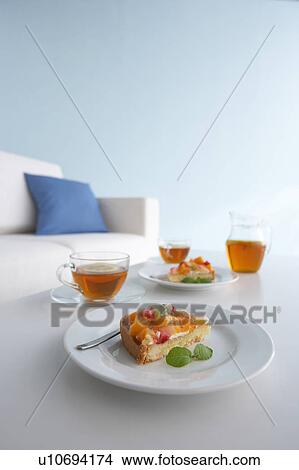 Picture - Tea and cake on table. Fotosearch