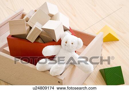 Picture - Teddy bear and building blocks. Fotosearch
