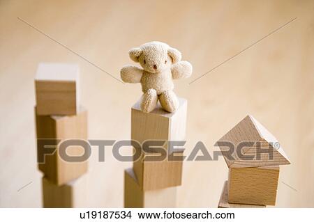 Teddy bear on top of building blocks View Large Photo Image Picture - Teddy bear on top of building blocks. Fotosearch