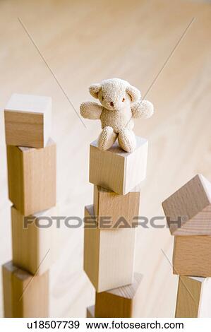 Teddy bear on top of building blocks View Large Photo Image Stock Photo - Teddy bear on top of building blocks. Fotosearch