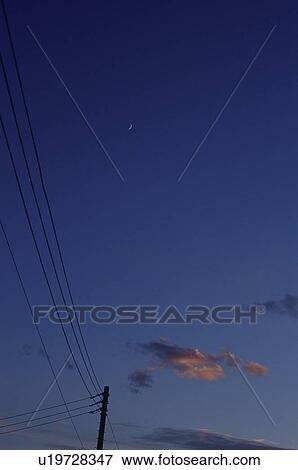 Stock Photo - Telephone wires under an evening sky. Fotosearch