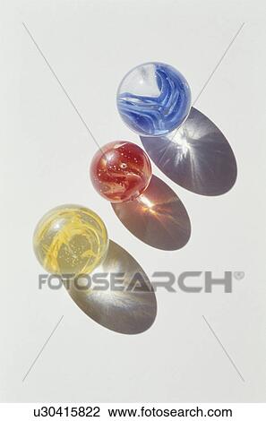 Three marbles on white background View Large Photo Image Stock Image - Three marbles on white background. Fotosearch