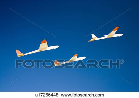 Three paper airplanes flying View Large Photo Image Stock Photo - Three paper airplanes flying. Fotosearch