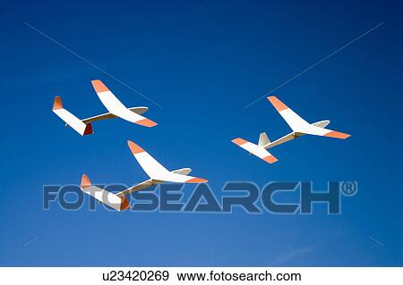 Three paper airplanes flying View Large Photo Image Stock Photo - Three paper airplanes flying. Fotosearch