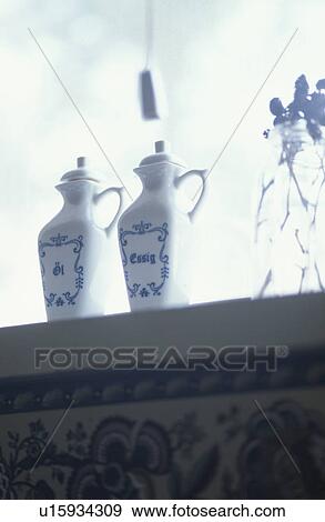 Two china bottles on window sill View Large Photo Image Stock Photo - Two china bottles on window sill. Fotosearch