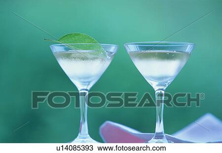 Two cocktails in martini glasses View Large Photo Image Stock Image - Two cocktails in martini glasses. Fotosearch