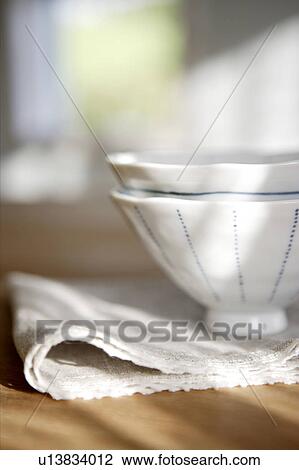 Stock Image - Two teacups and folded napkins. Fotosearch