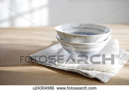 Stock Photograph - Two teacups and folded napkins. Fotosearch
