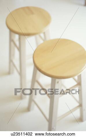 Stock Image - Two wooden stools. Fotosearch