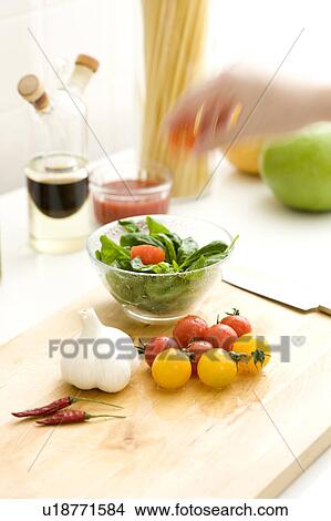 Picture - Vegetable, spice and herb on cutting board. Fotosearch