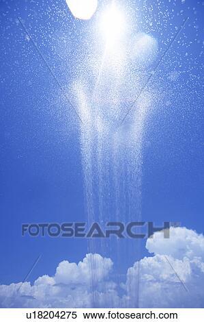 Stock Photography - Water splashing against blue sky. Fotosearch