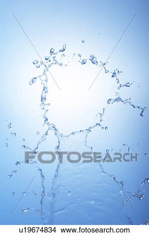 Picture - Water splashing, close up, blue background. Fotosearch