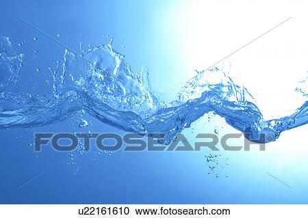 Stock Image - Water splashing, close up, blue background. Fotosearch