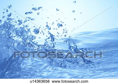 Stock Photo - Water splashing, close up, blue background. Fotosearch
