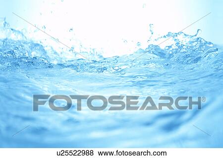 Stock Photo - Water splashing, close up, blue background. Fotosearch
