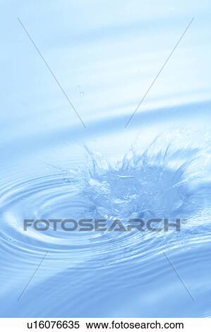 Stock Photography - Water splashing, close up, blue background. Fotosearch