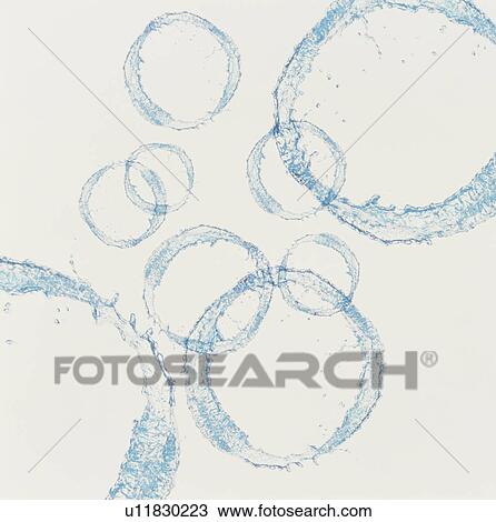 Stock Image - Water spray in rings. Fotosearch