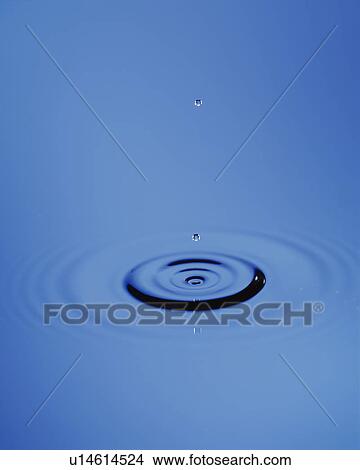 Picture - Waterdrop and a ripple. Fotosearch