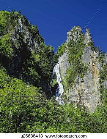 Waterfall cascading down cliff, Kamikawa-machi, Hokkaido, Japan View Large Photo Image Stock Image - Waterfall cascading down cliff, Kamikawa-machi, Hokkaido, Japan. Fotosearch