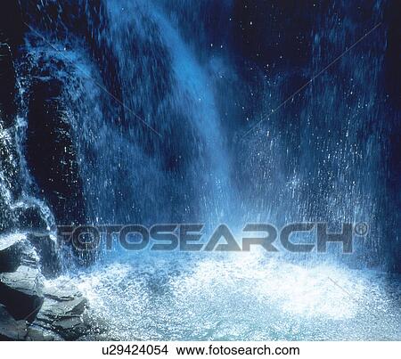 Picture - Waterfall cascading into pool. Fotosearch