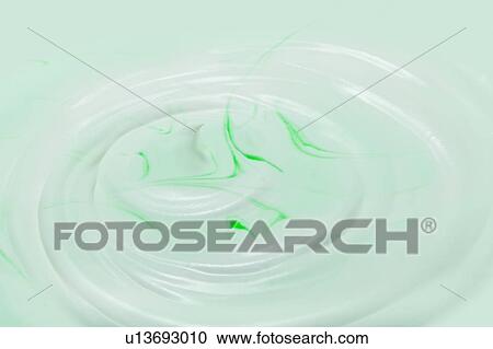 Stock Image - Whipped cream with color. Fotosearch
