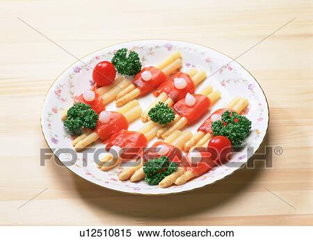 Stock Photography - White asparagus wrapped in smoked salmon. Fotosearch
