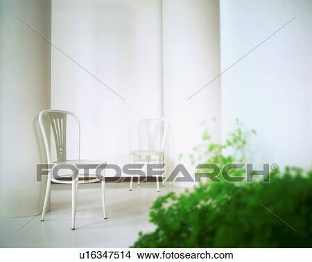 Picture - White chairs in white room. Fotosearch