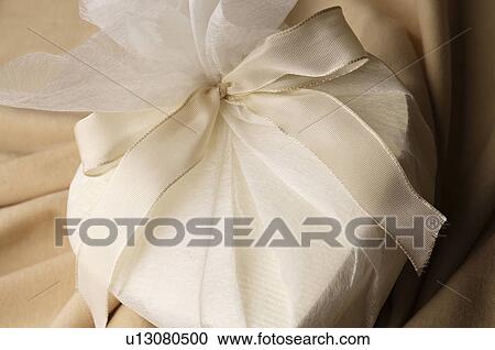 Stock Image - White heart shaped gift. Fotosearch