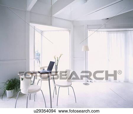 White room with table and laptop View Large Photo Image Picture - White room with table and laptop. Fotosearch