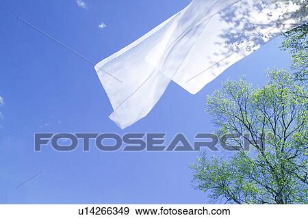 Stock Photo - White sheet blowing in wind. Fotosearch