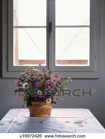 Wildflowers on a table by a window View Large Photo Image Stock Photograph - Wildflowers on a table by a window. Fotosearch