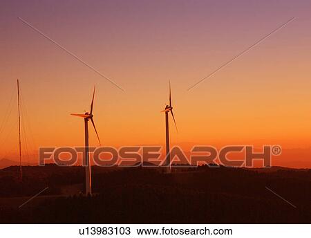 Stock Image - Wind turbines at sunset, Mie Prefecture, Japan. Fotosearch