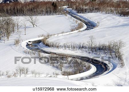 Winding road through a snow covered landscape, Kirifuri Kogen, Nikko, Tochigi Prefecture, Japan View Large Photo Image Stock Photo - Winding road through a snow covered landscape, Kirifuri Kogen, Nikko, Tochigi Prefecture, Japan. Fotosearch