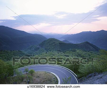 Picture - Winding road through forest. Nikko, Tochigi Prefecture, Japan. Fotosearch