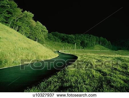 Windy road at night View Large Photo Image Stock Photo - Windy road at night. Fotosearch
