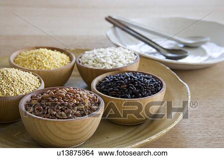 Picture - Wooden bowls of different grains. Fotosearch