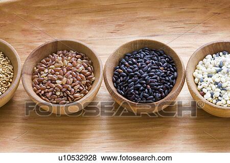 Stock Photo - Wooden bowls of different grains. Fotosearch