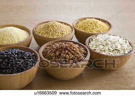 Stock Photo - Wooden bowls of different grains. Fotosearch