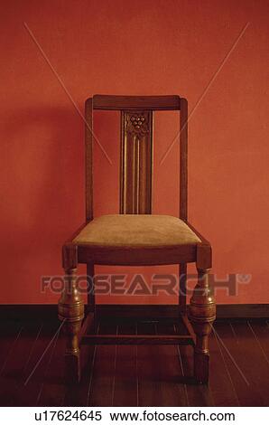 Wooden chair against red wall View Large Photo Image Stock Photography - Wooden chair against red wall. Fotosearch