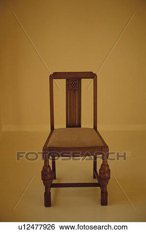 Wooden chair in yellow room View Large Photo Image Stock Photograph - Wooden chair in yellow room. Fotosearch