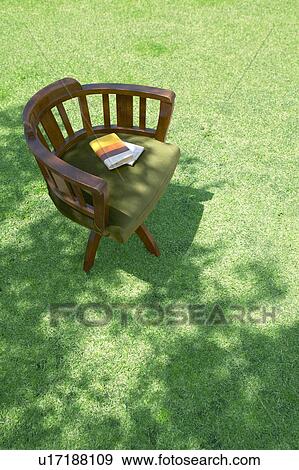 Stock Photo - Wooden chair on a lawn. Fotosearch