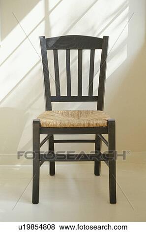 Stock Photo - Wooden chair with shadow from window. Fotosearch